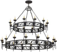 a large chandelier with many lit candles hanging from it's center ring