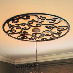 a chandelier hanging from the ceiling in a room