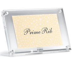 an acrylic business card holder with the word prine ribi on it