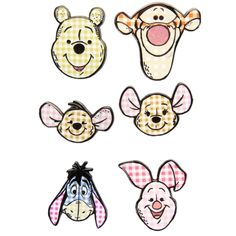 winnie the pooh and piggy face magnets are shown in four different colors