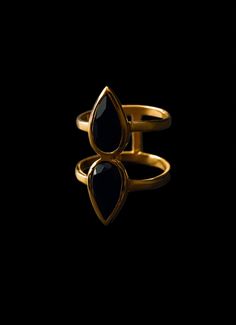 This double pear onyx ring is made with 14kg gold plating that has 3 microns of gold, adding a touch of elegance and class to any outfit. With its unique design and high-quality materials, this ring is the perfect accessory for any occasion. Make a statement with this unique and eye-catching ring, perfect for any occasion. Elevate your style with this must-have accessory. Available in size 5-10. Black Onyx Stone, Onyx Ring, Onyx Stone, Gold Plating, Black Onyx, Onyx, Sterling Silver Rings, Pear, Unique Design