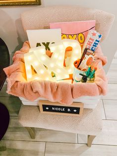 a chair with a light up letters sitting on top of it