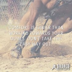 a man riding on the back of a brown horse next to a dirt field with words about comfort is easier than working towards your goal don't take the easy way out