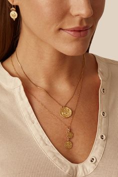 This serpentine chain necklace depicts a portrait stamped on a gold coin with a champagne diamond border. 18k gold plated sterling silver. 17" - 19" Adjustable. Style#: NGF-14622 Greek Nymph, Dangle Necklace, Designer Clothing Brands, Dangle Necklaces, Gold Coin, Chan Luu, Pearl Pendant Necklace, Champagne Diamond, Short Necklace