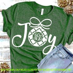 a green t - shirt with the word joy on it and an ornament