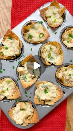 a muffin tin filled with chicken pot pies