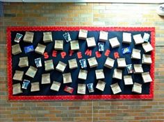 a bulletin board with books on it and the words september written in red letters above them