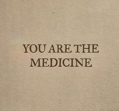 the words you are the medicine written on a piece of paper with brown ink in it