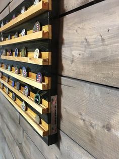 a wooden wall with several different types of buttons on it and hanging from the side