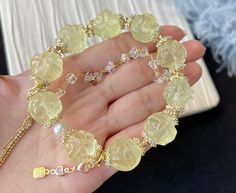 Material:Citrine Quartz beads, The metal hardware is 14k gold-plated and inlaid with zircon. size :Approx 15mm   quantity: one strand  6mm approx 29 pcs one strands 7mm approx25 pcs one strands 8mm approx 22 pcs one strands 9mm approx 21pcs one strands 10mm approx 19 pcs one strands 11mm approx 18pcs one strands 12mm approx 16 pcs one strands 13mm approx 16 pcs one strands 14mm approx 15 pcs one strands 15mm approx 14pcs one strands 16mm approx 14 pcs one strands 17mm approx 13pcs one strands 18 Gold Beaded Bracelets With Gemstone Accents, Gold Bracelets With Gemstone Accents And Round Beads, Elegant Gold Beaded Bracelets With Gemstone Accents, Elegant Yellow Beaded Crystal Bracelet, Gold Gemstone Crystal Bracelet, Gold Crystal Gemstone Bracelet, Elegant Beaded Citrine Jewelry, Luxury Gold Beaded Gemstone Bracelets, Gold Citrine Gemstone Beaded Bracelets