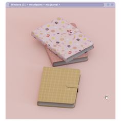 three small notebooks sitting next to each other on top of a pink tablecloth