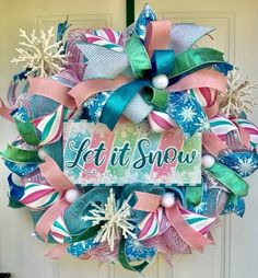 a colorful wreath that says let it snow