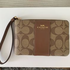 Brand New, Never Used With Detached Tag As Shown In Photo. Brown Pouch Wristlet For On-the-go, Chic Brown Wristlet With Removable Pouch, Chic Everyday Brown Wristlet, Coach Brown Clutch For Travel, Chic Brown Coach Wristlet, Chic Brown Coach Clutch, Chic Brown Rectangular Wristlet, Coach Wristlet, Signature Canvas