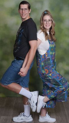 a man and woman are posing for a photo