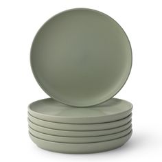 a stack of green plates sitting on top of each other