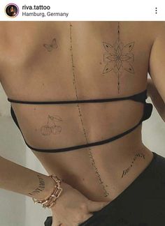 the back of a woman's body with tattoos on her chest and handwritten words