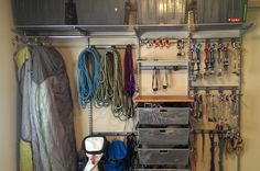 an organized garage with lots of hanging items