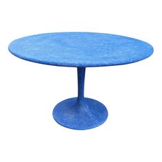 an image of a blue table on a white background that looks like it is made out of concrete