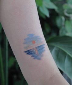 a person with a small tattoo on their arm