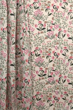 a curtain with pink and green flowers on it