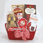 a red basket filled with chocolates, candy and candies