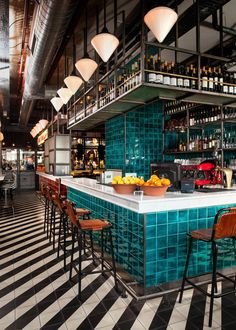 a bar with several stools in front of it