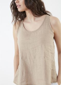 This breezy linen wardrobe builder will blend with almost everything in your closet—as well as the made-to-match separates listed below! Scoop-neck pullover with tonal topstitching and side vents. One and done. 100% linen Cold water wash, line dry Designed in France Linen Wardrobe, One And Done, Diva Boutique, Linen Tank Top, Linen Tank, Uniform Fashion, Boutique Stores, Sleeveless Tank Top, Sleeveless Tank