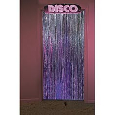 the disco door is decorated with purple tinsel