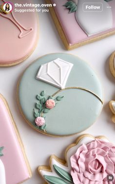 some decorated cookies are laying on a table