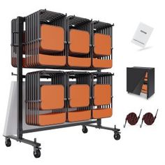 three orange chairs are stacked on top of each other in front of a black box