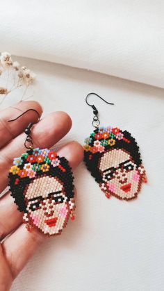 a pair of handmade beaded frida earrings