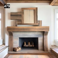 an empty fireplace in a white room with wood accents