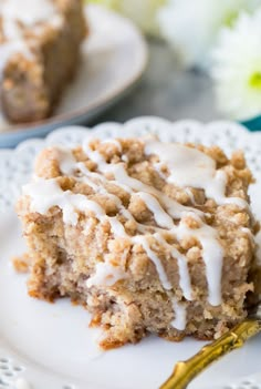 a close up of a piece of cake on a plate with frosting and icing