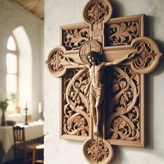 a wooden crucifix mounted to the side of a wall