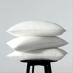 three pillows stacked on top of each other