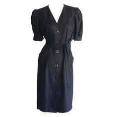 Superb vintage YSL "Rive Gauche" black double-faced linen dress, w/ detachable tie belt. Functional black + gold buttons down the front, w/ hidden hook and eye closure at bust + waist. Chic elbow length sleeves, which can be rolled up. The perfect little black dress that can easily be taken from day to night. Made in France. In great condition. Marked Size EU 36 (Approximateley Size Small Measurements: 36-38 inch bust 26 inch waist 40 inch hips 39 inches from top shoulder to hem Vintage Belted Workwear Dresses, Vintage Belted Dresses For Work, Formal Belted Linen Dress, Formal Linen Belted Dress, Formal Linen Button Dresses, Formal Linen Dresses With Buttons, Vintage Belted Formal Dress, Vintage Formal Belted Dress, Formal Linen Dress With Button Closure