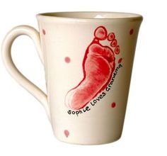 a white coffee cup with a red chili pepper on it