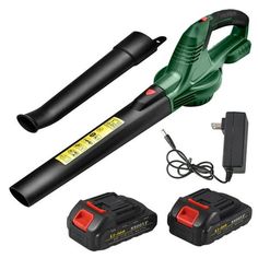 a green and black blow dryer sitting next to two batteries