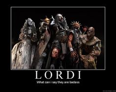 an image of lordi that is in the middle of a group of people with evil faces