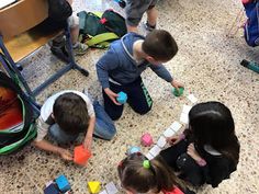 several children playing with toys on the floor