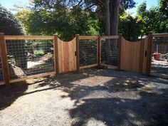 a wooden fence with wire around it