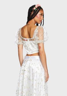 be like music and give 'em a taste of your magic. This cropped bustier top has a non-stretch tulle construction, floral embroidery all over, an opaque satin bodice base, short puff sleeves with elastic trim, underwire bust cups, and a back zip closur Fitted White Crop Top With Boned Bodice, White Cropped Crop Top With Boned Bodice, White Crop Top With Boned Bodice For Party, Cropped Corset With Fitted Bodice For Parties, White Boned Bodice Crop Top For Party, Spring Satin Fitted Corset, Party Crop Top With Fitted Bodice, Summer Cropped Crop Top With Boned Bodice, Fitted Cropped Bodice Crop Top For Party