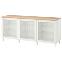 a white bookcase with wooden top and shelves