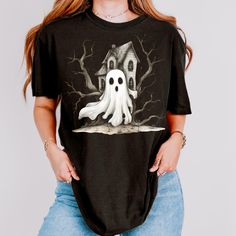 Comfort Colors Halloween Shirt, Cute Ghost Country Farmhouse TShirt, Graphic Fall Shirt, Halloween Party Shirt, Halloween T-Shirt Him or Her This will be the t-shirt you will wear all Halloween Season. Designed on Comfort Colors "Comfort Colors 1717" garment-dyed t-shirt. This tee is made 100% with ring-spun cotton. The soft-washed, garment-dyed fabric brings extra coziness to your wardrobe, while the relaxed fit makes it an excellent daily choice.  The double-needle stitching throughout the tee Novelty Short Sleeve Top For Costume Party, Halloween Novelty T-shirt With Graphic Print, Spooky Halloween T-shirt With Graphic Print, Spooky Black Tops For Costume Party, Halloween Character Print Tops For Costume Party, Black Shirt For Halloween Costume Party, Horror Graphic Print Top For Costume Party, Novelty Short Sleeve T-shirt For Costume Party, Novelty T-shirt For Costume Party With Short Sleeves