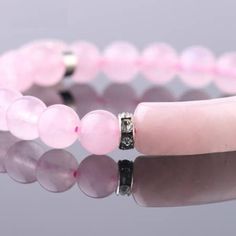 Rose Quartz Bracelet, Alloy Charm Bracelet,Love Bracelet, Women Jewelry, unconditional love bracelet.  Rose Quartz is the love stone! Adds positive love energy to relationships. Compassion and forgiveness. Calming, helps clear stored anger, resentment, jealousy, fears. Replaces negativity with harmony. Helps to balance upper four chakras and eases sexual/emotional imbalances. Enhances self-confidence and creativity. Aids kidneys and circulatory system, promotes release of impurities. The rose quartz crystal can be worn as a bracelet or place a stone under your pillow at night.  Due to the nature of stone formations and our studio lighting, every gemstone product will vary slightly, in shape, size, color, pattern and will not be an exact replica of the one you see in photos. Merchandise enl Pink Natural Stones Bracelet For Friendship, Pink Natural Stone Bracelets For Friendship, Pink Beaded Bracelets With Natural Stones For Friendship, Pink Rose Quartz Bracelet For Friendship, Valentine's Day Pink Rose Quartz Bracelets, Pink Rose Quartz Bracelets For Valentine's Day, Pink Spiritual Bracelets For Valentine's Day, Rose Quartz Round Beads Bracelet For Valentine's Day, Pink Spiritual Bracelet For Mother's Day