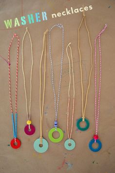 five necklaces are hanging on a brown background with the words washer necklaces