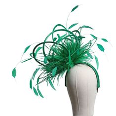 Gorgeous Large fascinator fixed with a covered headband also in emerald green As you can see from the photographs i also add an elastic millinery band at the back of the hat which goes under the hair at the nape of the neck    Can be made in over 30 different colours of satin and 30 different feather colours. It's as easy as....   1)Choose your base colour and i will use this as the satin colour , the colour of your headband and primary feather colour.   2)Choose a highlight colour and i will us Elegant Green Headband For Races, Green Headband For Royal Ascot, Elegant Green Feathered Headpieces, Green Headband For Evening Occasions, Formal Green Headband Headpiece, Green Evening Headband, Green Headband For Evening, Green Formal Headband, Formal Green Headband