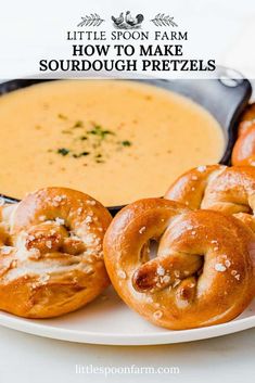 some pretzels are on a plate next to a bowl of soup