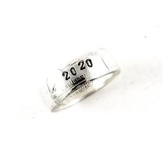 a silver ring with the number 20 on it