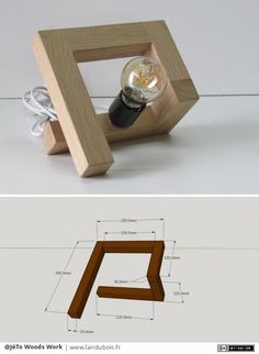 a wooden object with a light bulb in the middle and an image of a lamp inside it